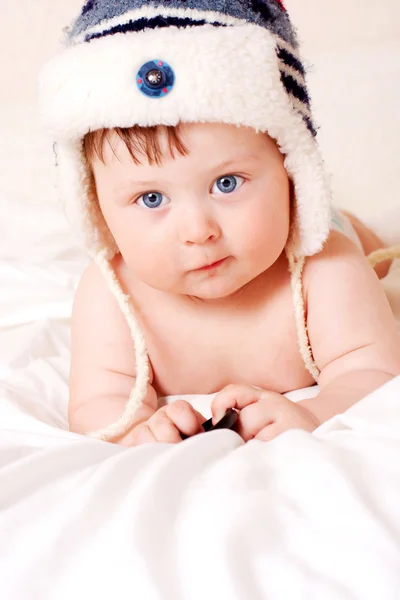 Baby in fur-cap — Stock Photo, Image