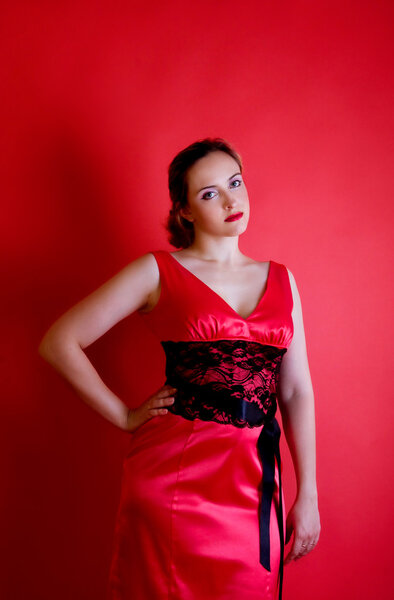 Portrait of beautiful girl in red dress