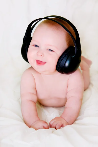 Baby i hörlurar — Stockfoto