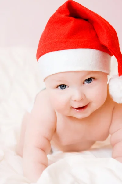 Baby in christmas hat Stock Picture