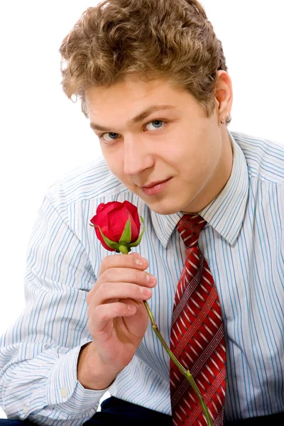 Молодой человек с розой — стоковое фото