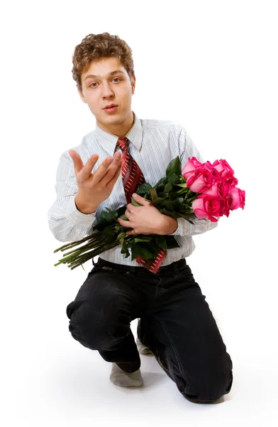 Νεαρός άνδρας με τριαντάφυλλα — Φωτογραφία Αρχείου