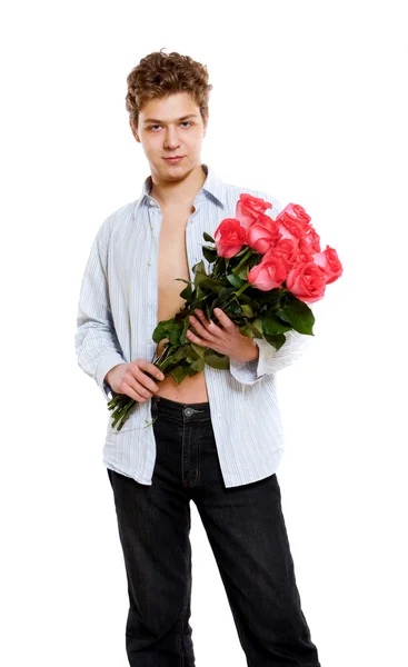 Jonge man met rozen — Stockfoto