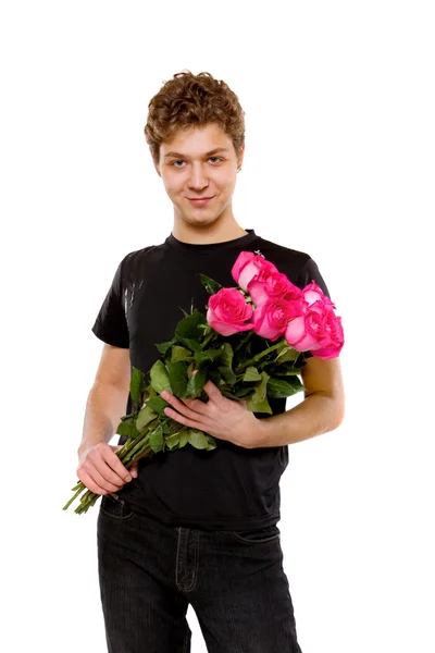 Jonge man met rozen — Stockfoto