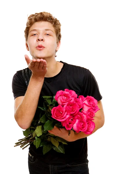 stock image Young man with roses