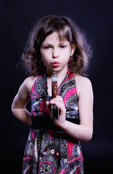 Little girl with pistol — Stock Photo, Image