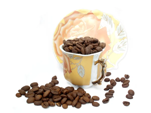 Copo com grãos de café e salsicha — Fotografia de Stock
