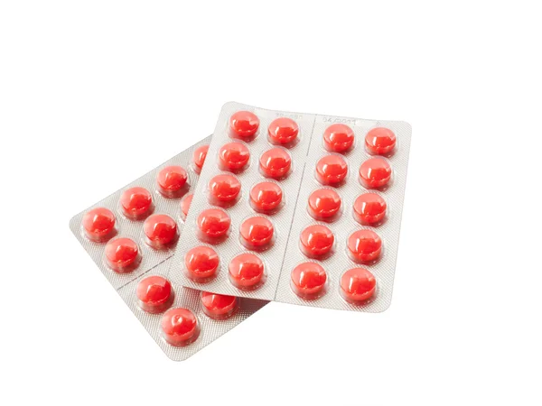 Porci pilulek izolovaných na bílém pozadí — Stock fotografie