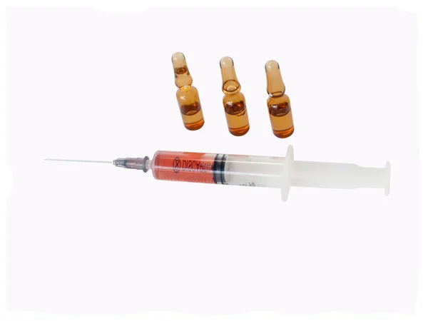 Filled syringe and ampules. — Stock Photo, Image