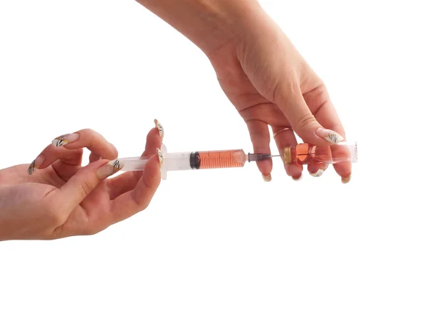Filled syringe in a woman hands. — Stock Photo, Image