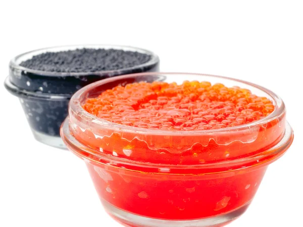 Caviar vermelho e preto em frascos de vidro — Fotografia de Stock