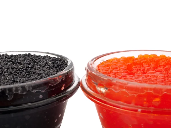 Caviar vermelho e preto em frascos de vidro — Fotografia de Stock