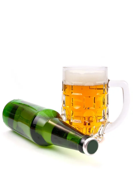 Beer in a bottle and in a mug against wh — Stock Photo, Image