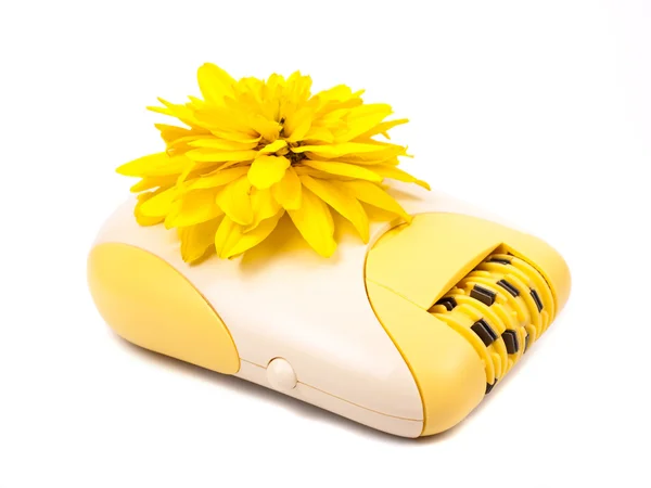 Epilator and yellow flower — Stock Photo, Image
