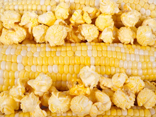 Corn in a cobs and popcorn Royalty Free Stock Photos