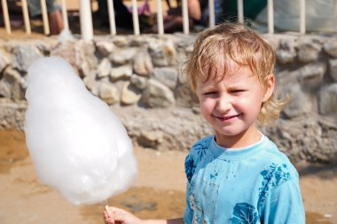 Boy enjoyong cotton candy clipart