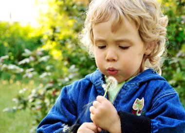 Little girl blowing clipart