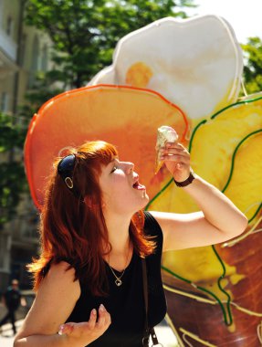 Woman eating melting ice cream clipart