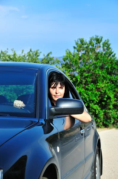 Young brunette driving car — Stock Photo, Image