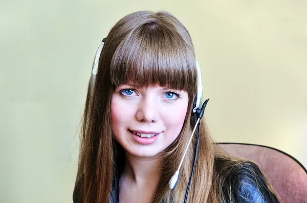 Smiling blue-eyed girl operator — Stock Photo, Image