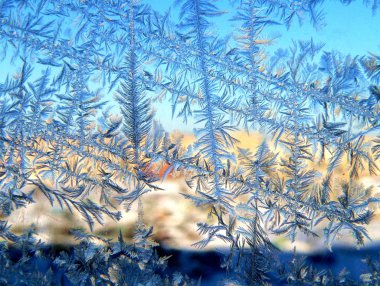 Winter patterns on windows glass clipart