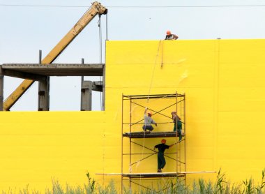 Workers on scaffolding clipart