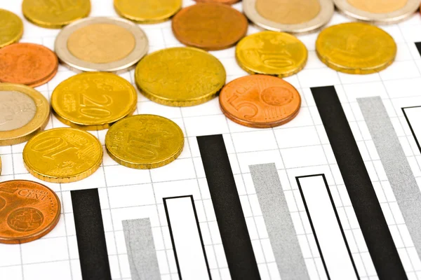 Monedas y diagrama — Foto de Stock