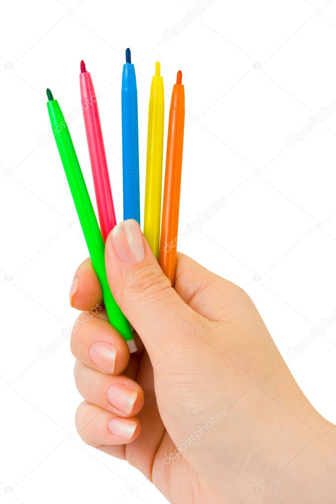 Hand with multicolored pens