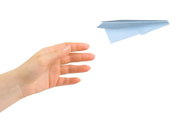Hand en vliegende geld vliegtuig — Stockfoto