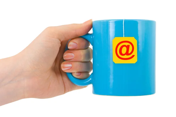 Hand and cup of tea with e-mail symbol — Stock Photo, Image