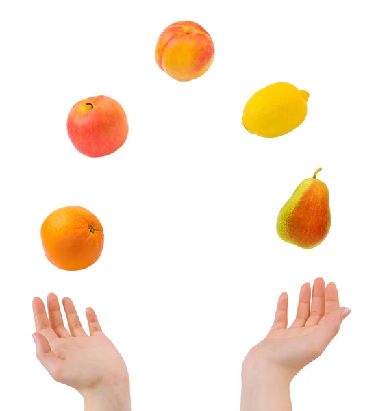 Jonglering händer och frukter — Stockfoto