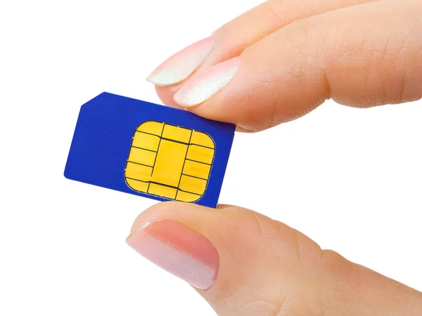 Cartão SIM de mão e telefone — Fotografia de Stock