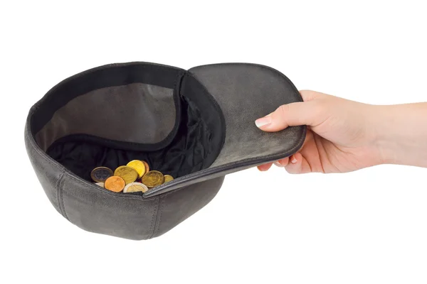 Hand and cap with money — Stock Photo, Image