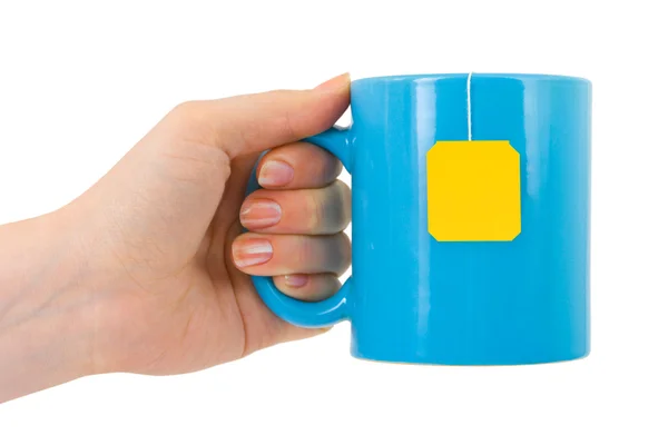 Ruka a šálek čaje — Stock fotografie