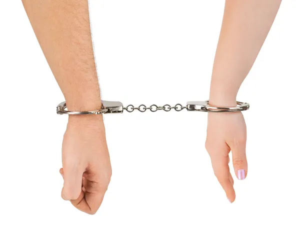 Man and woman hands and handcuffs — Stock Photo, Image