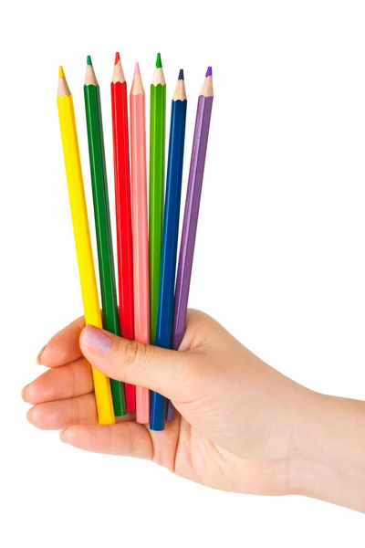 Рука с разноцветными карандашами — стоковое фото