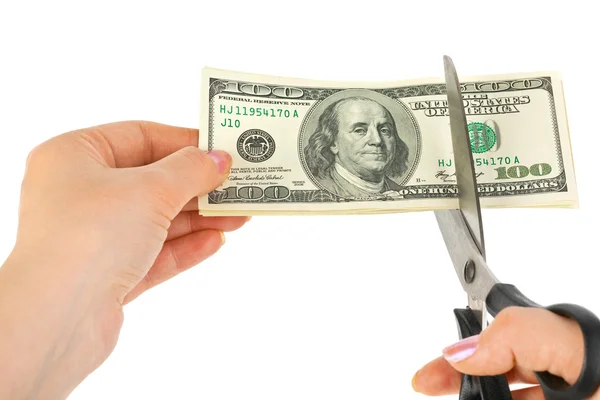 Handen met schaar snijden geld — Stockfoto