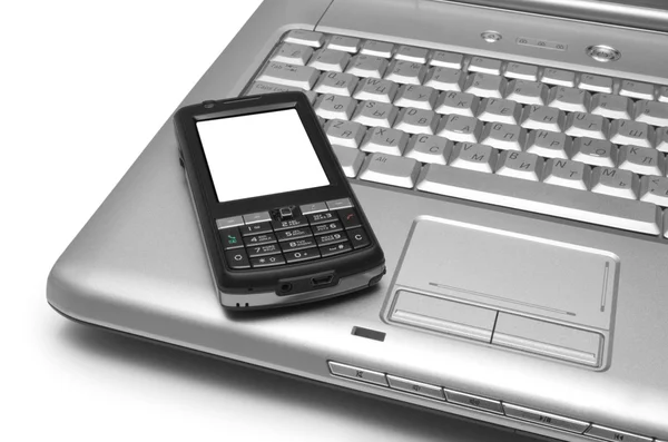 Mobilní telefon a notebook — Stock fotografie