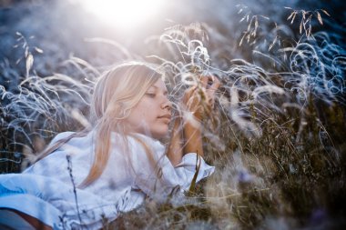 Woman in feather grass clipart