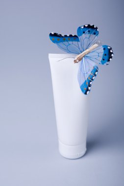 Cosmetic tube with butterfly clipart