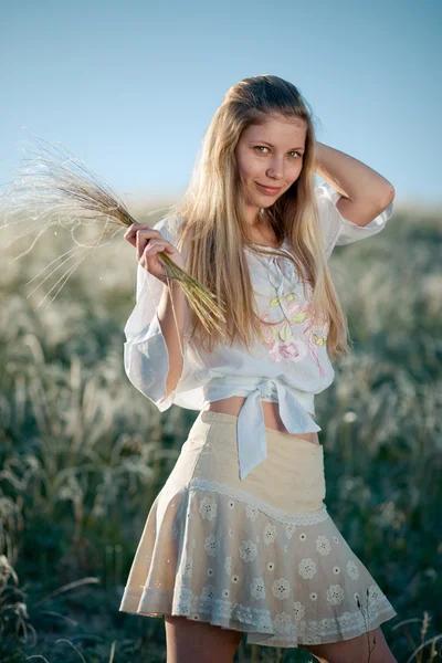Rural girl with buch of feather grass — Stock Photo, Image
