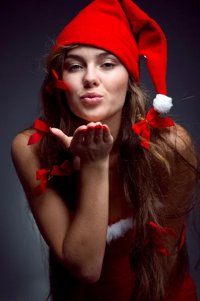 Kissing santa helper girl — Stock Photo, Image