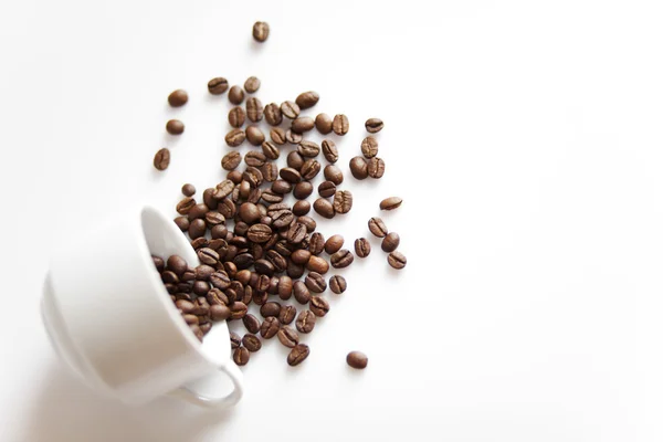 stock image Cup with sparse coffee beans