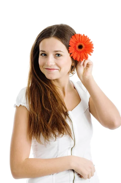 Beautiful woman with a bright red flower — Stock Photo, Image