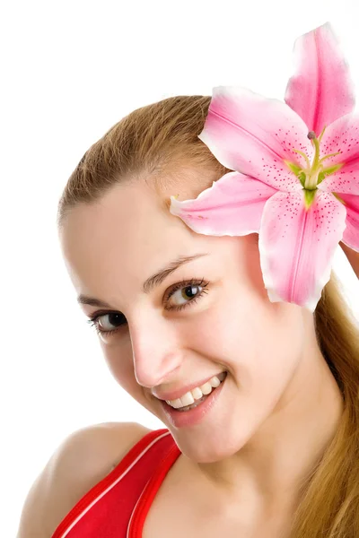 Szép lány egy rózsaszín liliom — Stock Fotó