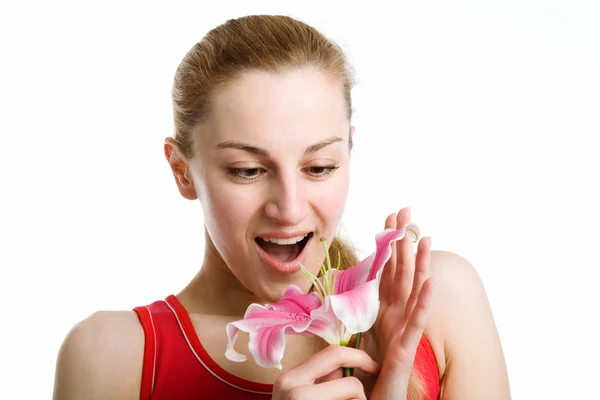 Nice girl with a pink lily — Stock Photo, Image