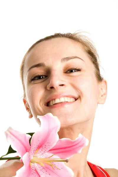 Menina agradável com um lírio rosa — Fotografia de Stock