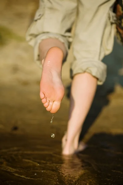 stock image Barefoot legs in river