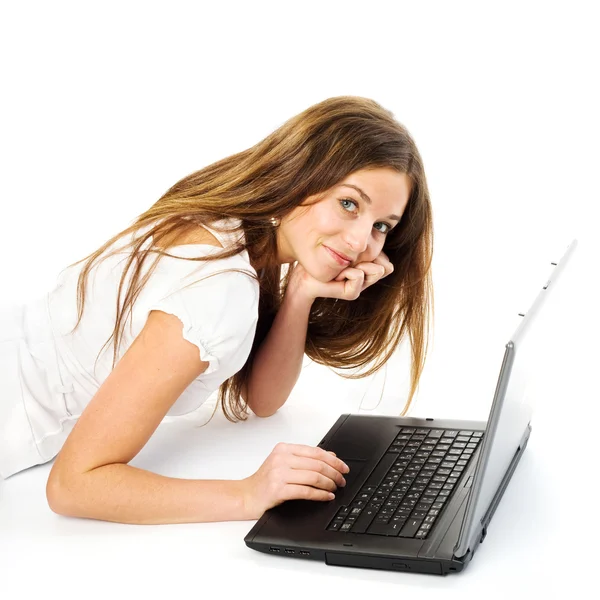 工作用的笔记本电脑的女孩 免版税图库照片