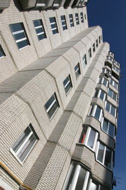 Multi-storey house of white brick clipart